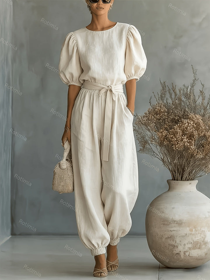 Bohemian-style Puff Sleeve Jumpsuit with Tie-waist. Features Side Pockets for Convenience, a Fit, and Comfortable Casual Wear