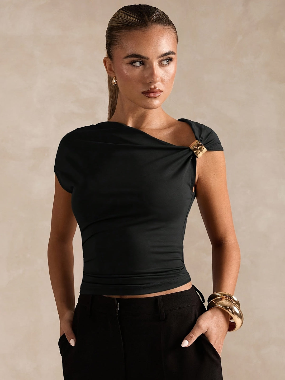 New Spring And Summer Fashion Features a Easy And Elegant Solid Color Top with Asymmetric Off-Shoulder Design And Metallic Accents for Women. This Stylish T-Shirt Is Tailored with a Solid Color And Asymmetric Neckline