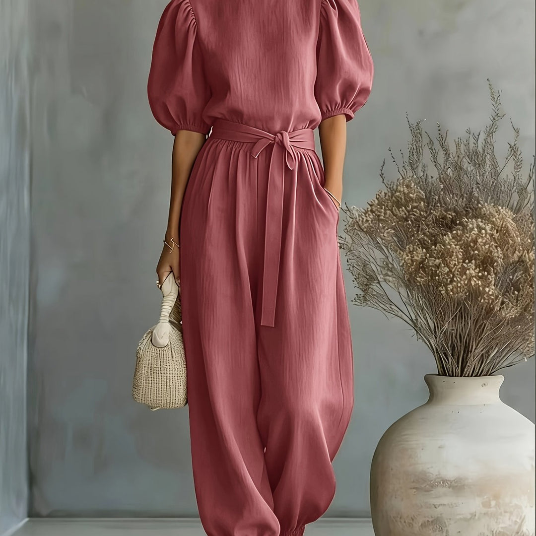 Bohemian-style Puff Sleeve Jumpsuit with Tie-waist. Features Side Pockets for Convenience, a Fit, and Comfortable Casual Wear