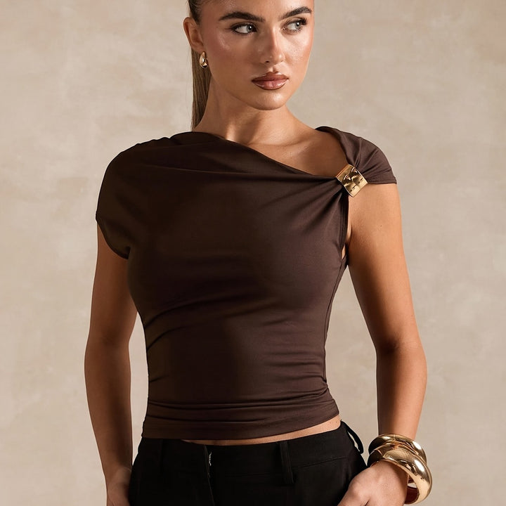 New Spring And Summer Fashion Features a Easy And Elegant Solid Color Top with Asymmetric Off-Shoulder Design And Metallic Accents for Women. This Stylish T-Shirt Is Tailored with a Solid Color And Asymmetric Neckline