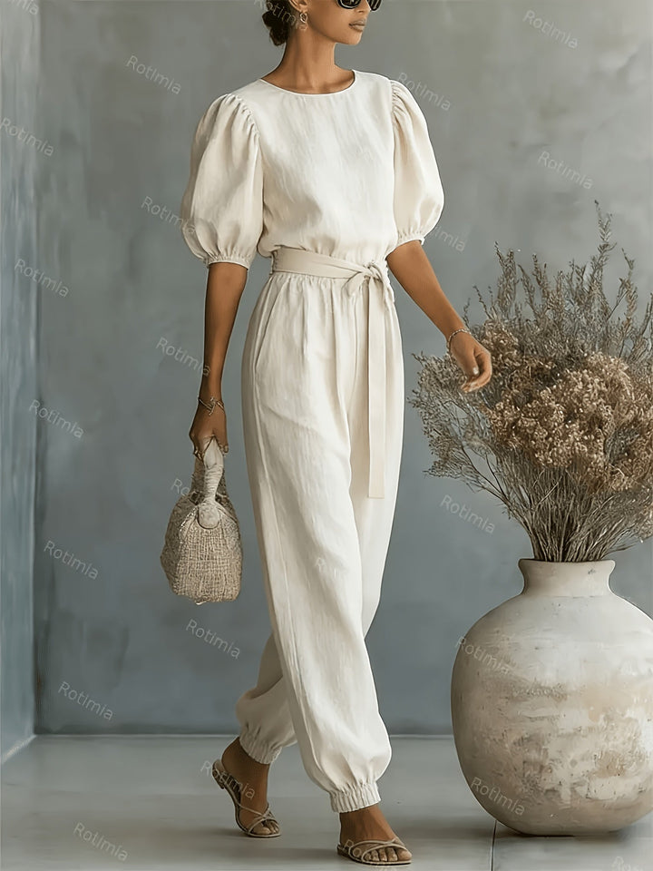 Bohemian-style Puff Sleeve Jumpsuit with Tie-waist. Features Side Pockets for Convenience, a Fit, and Comfortable Casual Wear