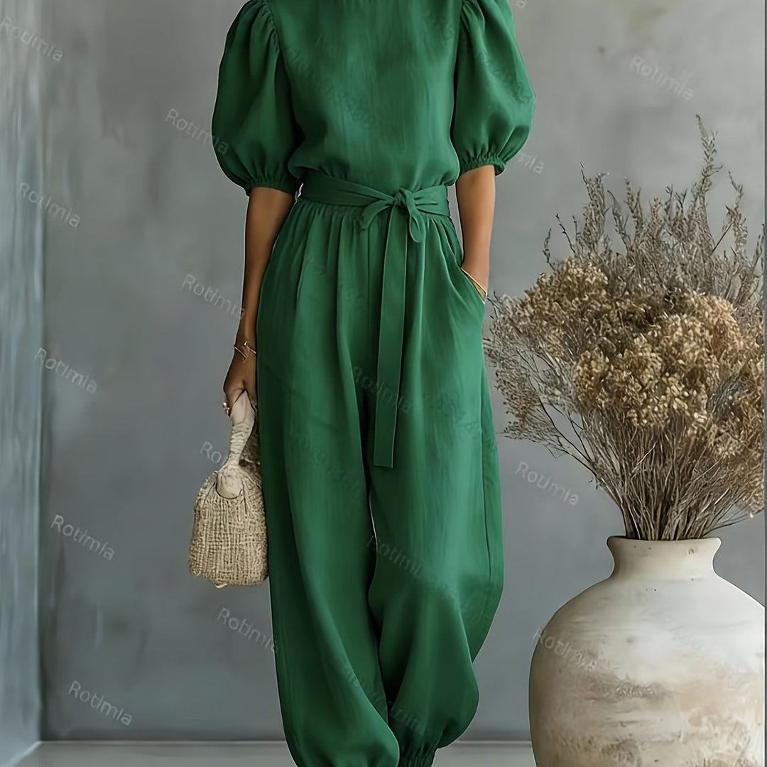 Bohemian-style Puff Sleeve Jumpsuit with Tie-waist. Features Side Pockets for Convenience, a Fit, and Comfortable Casual Wear