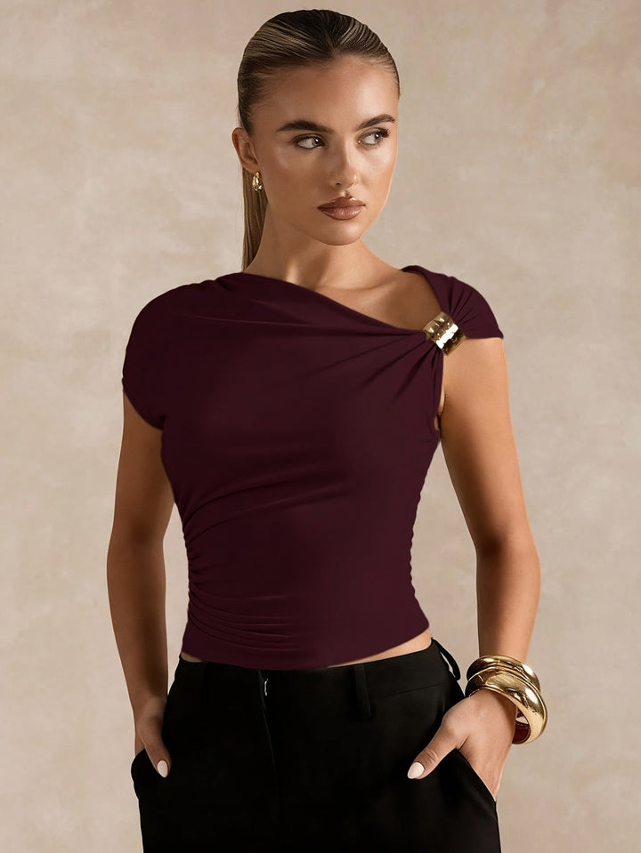 New Spring And Summer Fashion Features a Easy And Elegant Solid Color Top with Asymmetric Off-Shoulder Design And Metallic Accents for Women. This Stylish T-Shirt Is Tailored with a Solid Color And Asymmetric Neckline