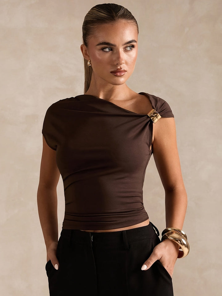 New Spring And Summer Fashion Features a Easy And Elegant Solid Color Top with Asymmetric Off-Shoulder Design And Metallic Accents for Women. This Stylish T-Shirt Is Tailored with a Solid Color And Asymmetric Neckline