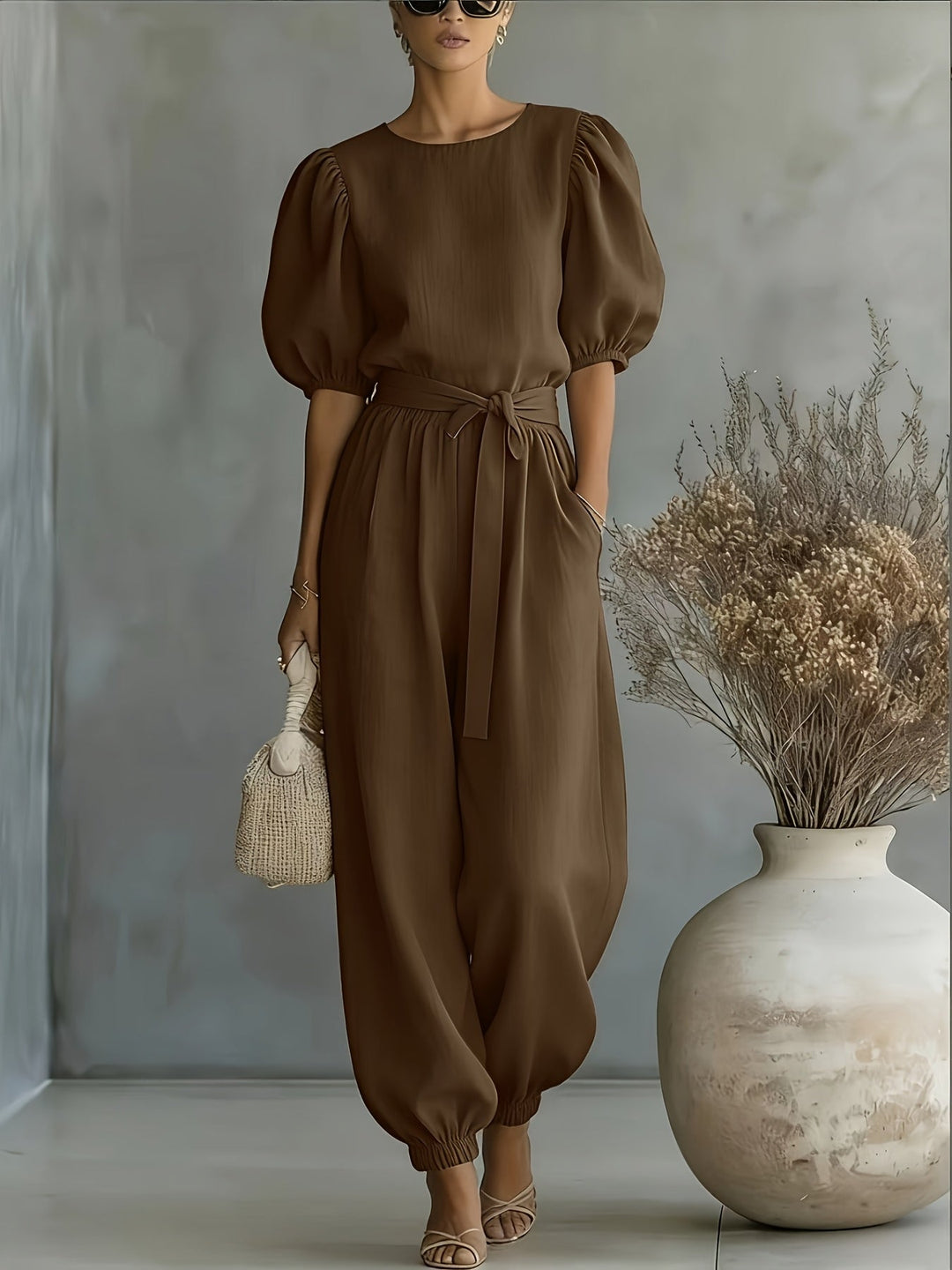 Bohemian-style Puff Sleeve Jumpsuit with Tie-waist. Features Side Pockets for Convenience, a Fit, and Comfortable Casual Wear
