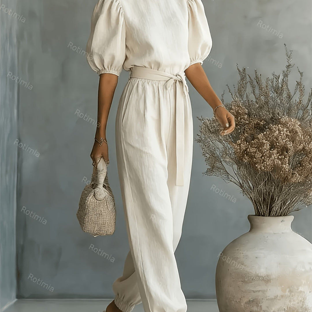 Bohemian-style Puff Sleeve Jumpsuit with Tie-waist. Features Side Pockets for Convenience, a Fit, and Comfortable Casual Wear