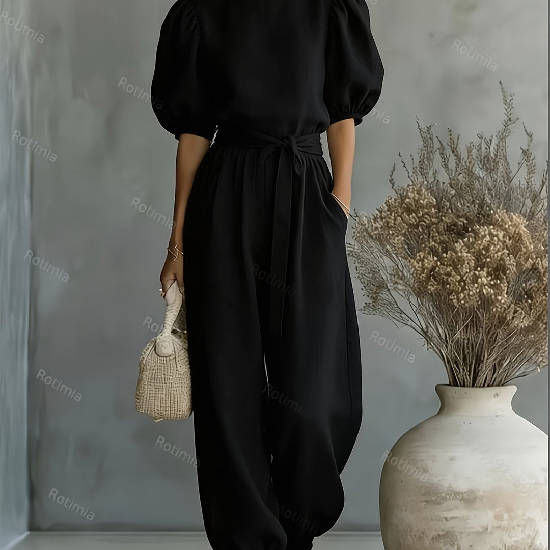Bohemian-style Puff Sleeve Jumpsuit with Tie-waist. Features Side Pockets for Convenience, a Fit, and Comfortable Casual Wear