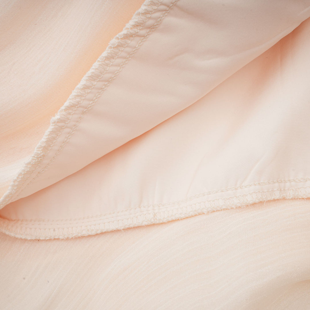 Eugénie fully-pleated ruffled mini dress in Neutrals